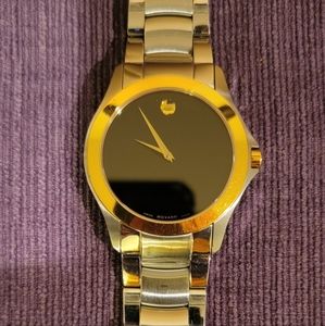 Movado, fits approx 8in wrist, Stainless steel, gold-tone.Blk dial w/gold hands